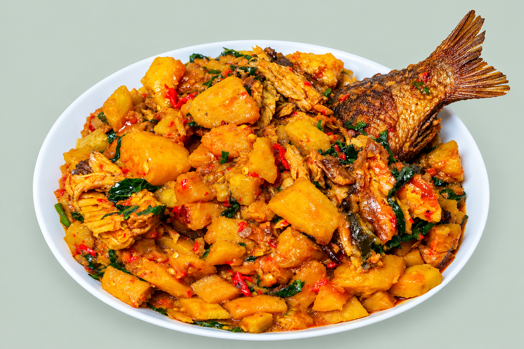 Nigerian yam porridge prepared with vegetables and fish
